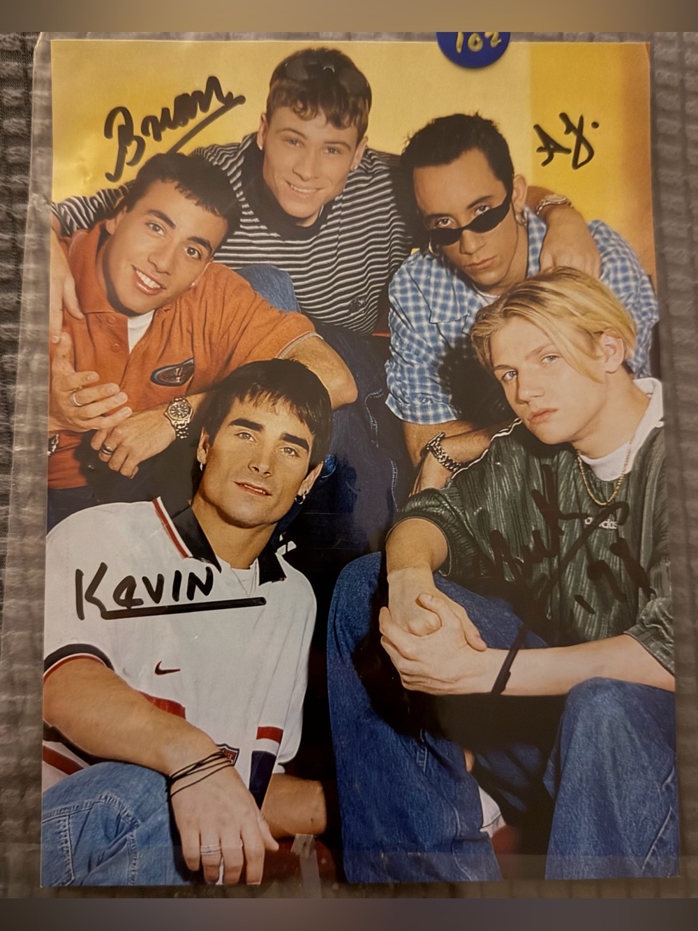 Backstreet Boys Boy Band Photo with Yellow Backdrop and Multi-Color Outfits